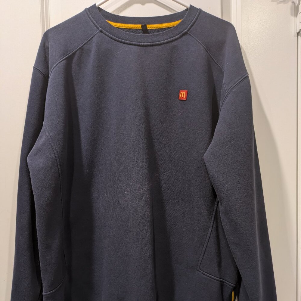 McDonald's branded crewneck sweatshirt.